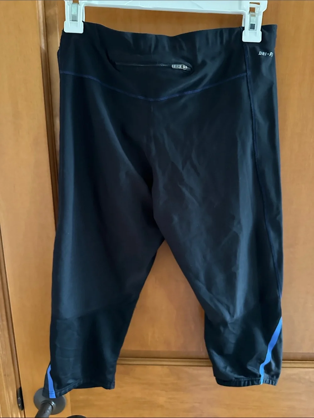 Nike Black Capri Leggings with Blue Trim and White Swoosh Back Zip Pocket Capri